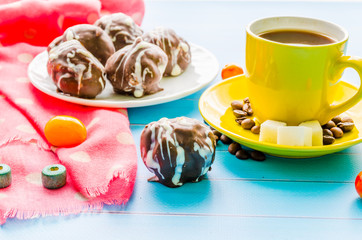 Still life with cup of tea and sweets