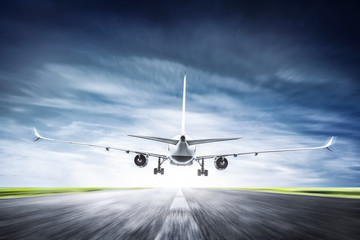 Passenger airplane taking off on runway