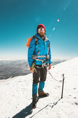 Man alpinist climbing in mountains glacier Travel Lifestyle endurance concept adventure active...