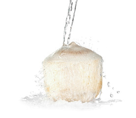 Obraz na płótnie Canvas Young peeled coconut with jet of water on white background