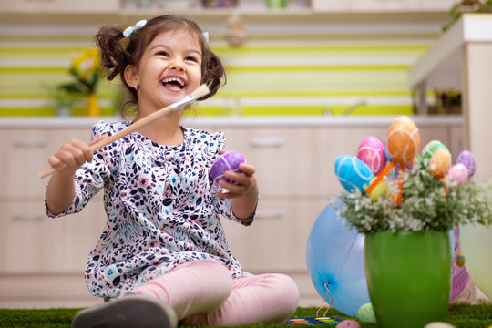 Little girl having fun with  Easter egg