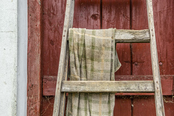 Ladder and an old towel in a barn