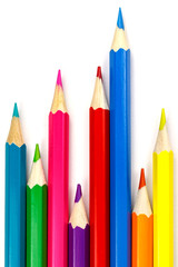 Set of colored pencils on a white background, chaotic arrangement