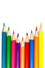 Fototapeta premium Set of colored pencils on a white background, arrangement with an internal corner