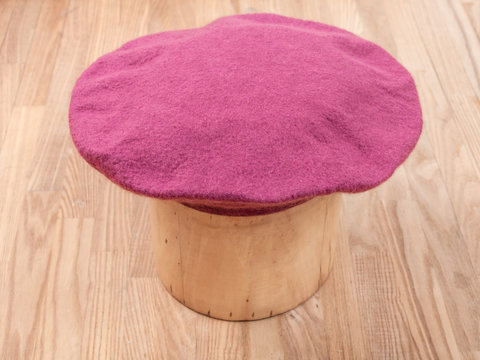 handmade felt beret is molded on wooden hat block