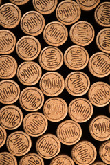 Background of used wine corks. Wall of many different wine corks. Closeup of wine corks.
