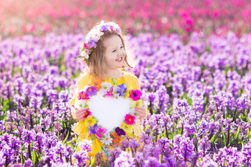 Obraz na płótnie Canvas Little girl in hyacinth field