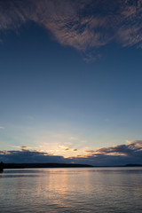 Sunset and clouds on a harbor