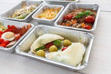 Healthy food take away in foil boxes, meat and vegetables