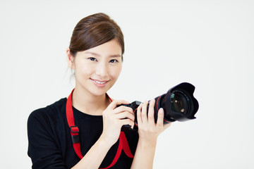 Fototapeta premium カメラを構える女性