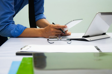 Businessman working at office. Digital tablet laptop computer smart phone using, keyboard. Connection internet application online. Finance manager. Banking.