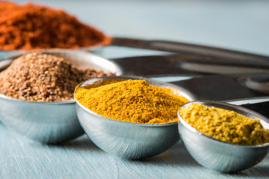 Turmeric and Other Spices in Measuring Spoons