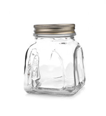 Empty glass jar with aluminum lid over white background