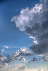 Cumulus clouds with rays of sun