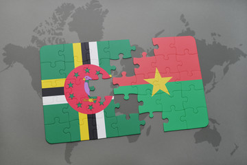 puzzle with the national flag of dominica and burkina faso on a world map