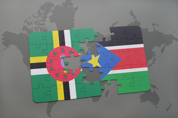 puzzle with the national flag of dominica and south sudan on a world map
