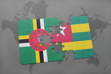 puzzle with the national flag of dominica and togo on a world map