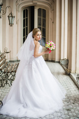 Beautiful bride walking in the old castle