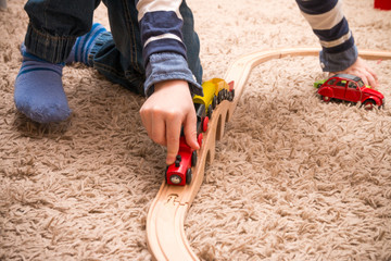 Boy playing with train