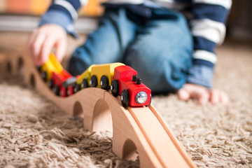 Boy playing with train