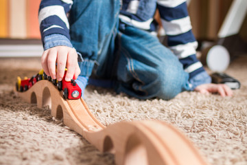 Boy playing with train