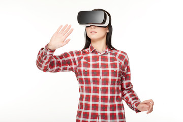 Young woman in VR headset traveling in cyberspace.
