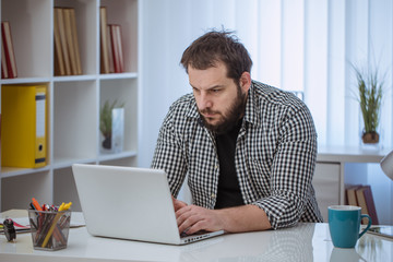 Young man in office