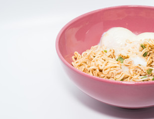Instant noodle food with eggs in a cup on white background