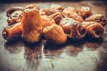 fresh dates on wooden table
