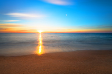 Fototapeta premium Seascape during sundown. Beautiful natural seascape, golden sands.
