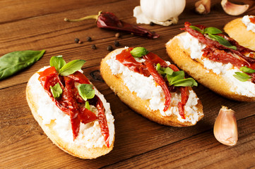 Italian sandwiches - bruschetta with cheese, tomato and basil