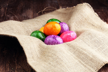 Row of Easter eggs on wooden table