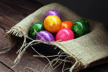Row of Easter eggs on wooden table