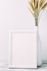 Ripe wheat and empty wooden frame