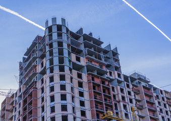 Gray-pink high rise building under construction