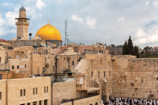A view of Temple Mount in the old city of Jerusalem, including the Western Wall and golden Dome of the Rock, Jerusalem, Israel.