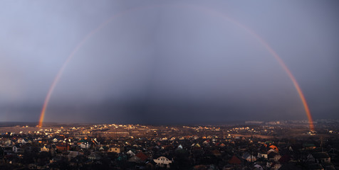 Panorama of the rainbow over the city Kharkov after the rain from the mountain
