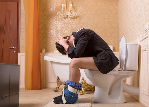 Diarrhea or constipation problem, man on toilet