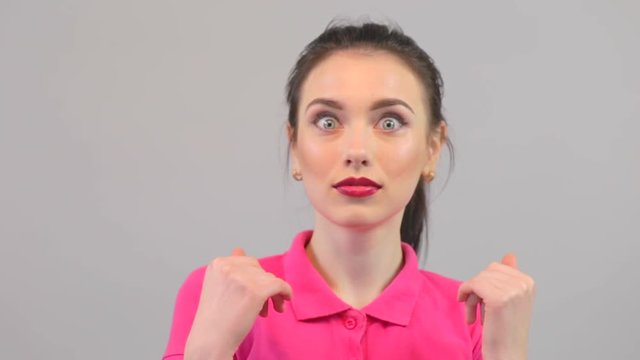 Attractive young woman ecstatic face expressions. Surprised excited happy woman closeup portrait.