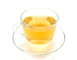 Isolated transparent cup of herbal tea on white