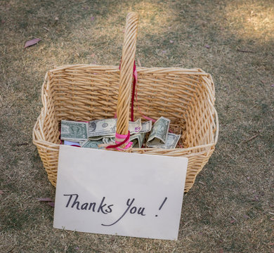 Thank You, Donation Charity Tip Gift Basket With Money Lying On Ground