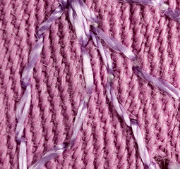 pink fabric as a background. macro