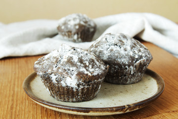 Homemade Chocolate Cupcake on plate against a background