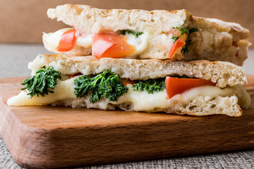 Turkish Bazlama Tost / Toast sandwich with melted cheese, tomatoes and dill.