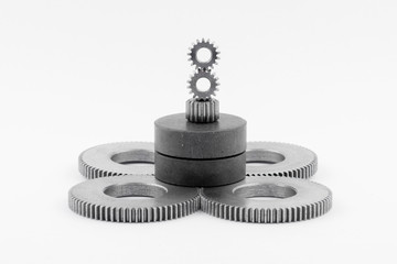 Isolated metal pinions gear. The iron gear on a white background. Pinions in the gearbox. Parts to...