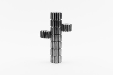 Isolated metal pinions gear. The iron gear on a white background. Pinions in the gearbox. Parts to...