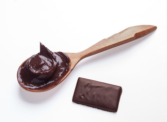 Chocolate cream on the wooden spoon
