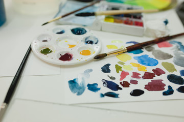 Desktop artist drawing watercolor