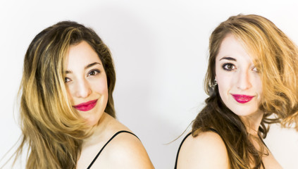 Two beautiful women Portrait over White Background