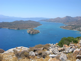 Fototapeta na wymiar Crete. Panorama of Mirabello bay with Spinalonga fortress and Elounda. 